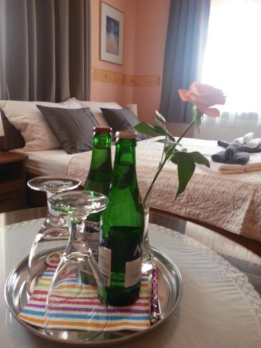 two bottles of beer on a tray on a table at Pension Villa Marit in Prague