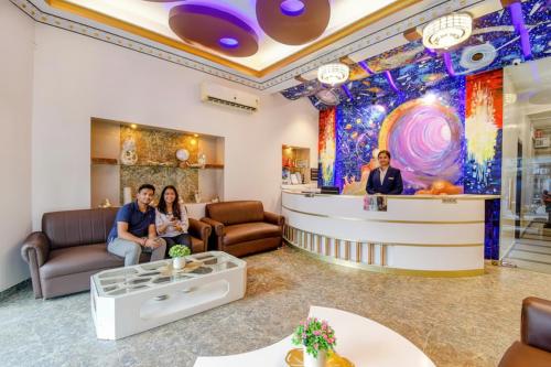 a group of people sitting in a waiting room at FabHotel Prime Rockstar Suites in Kolkata