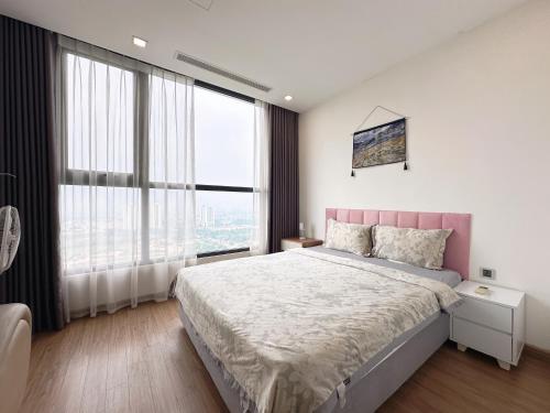 Ένα ή περισσότερα κρεβάτια σε δωμάτιο στο Jolie Apartment Vinhomes Green Bay