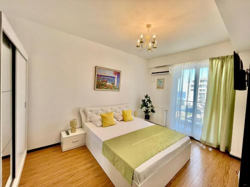 Giường trong phòng chung tại Summerland Nico