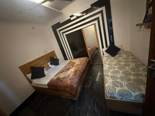 a bedroom with a large bed and a mirror at Sodhi Residency in Amritsar