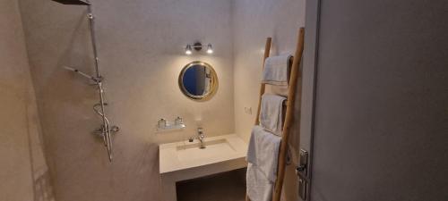 a bathroom with a sink and a mirror at city garden Kech in Marrakesh