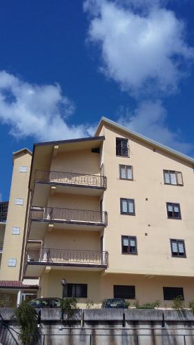 a large building with balconies on the side of it at Hotel Caimo Bed-Breakfast in Lagonegro