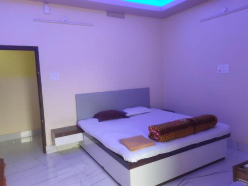 a bedroom with a bed in a room at Hotel Star, Agartala in Agartala