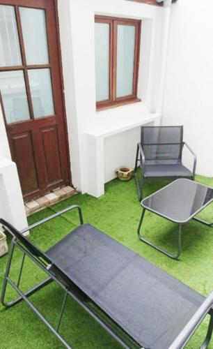 Et opholdsområde på Plein centre Cosy 38m2 avec accès terrasse, spa et sauna communs Place Dalton