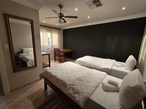 Ένα ή περισσότερα κρεβάτια σε δωμάτιο στο Vogelsang Guesthouse