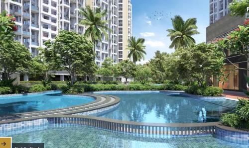 Impresión artística de una piscina en un edificio. en Aesthetic Modern 2BHK Work & Relax Balcony Views, en Jāmb