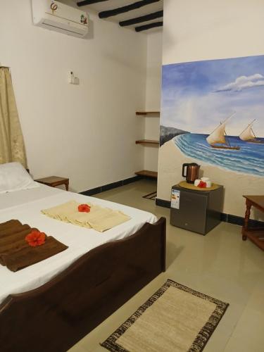 En eller flere senge i et værelse på KIVi Cottages Nungwi