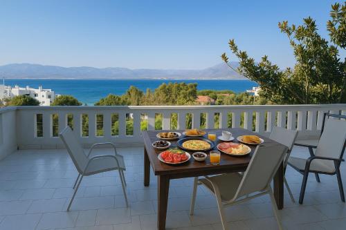a tray of food on a table on a balcony at Caecilia & Lawrence Villa in Chalkida