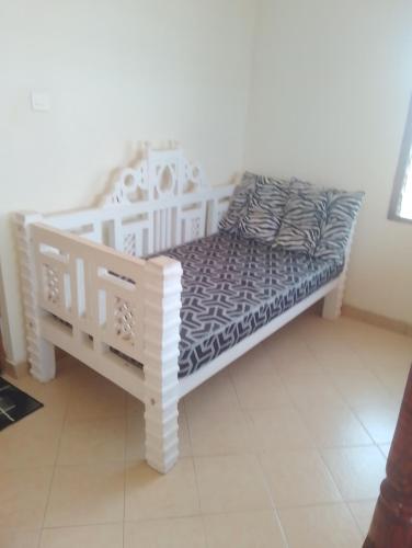 En eller flere senge i et værelse på Casuarina Cosy Home