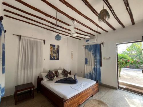 Postel nebo postele na pokoji v ubytování 1Zi hotel and beach club