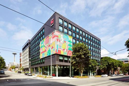 a building with a painting on the side of it at citizenM Seattle South Lake in Seattle