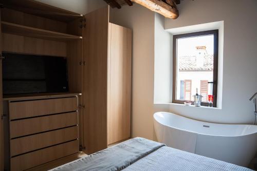 Postel nebo postele na pokoji v ubytování Attico Malatesta