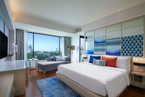 Un pat sau paturi într-o cameră la Amari Pattaya