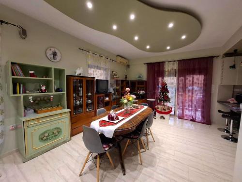 a dining room with a table and chairs in a room at Eretria Panorama Seaview Retreat with Balcony in Eretria