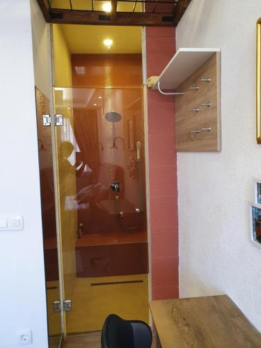 een badkamer met een douche met een glazen deur bij Luxury Family Villa on Neretva - Private Pool - Vila Kuća Mira in Konjic