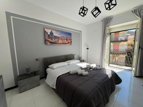 En eller flere senge i et værelse på D'Aversa Rooms