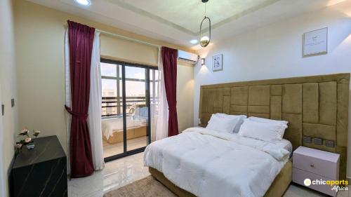 Postel nebo postele na pokoji v ubytování Chic studio with parking and rooftop