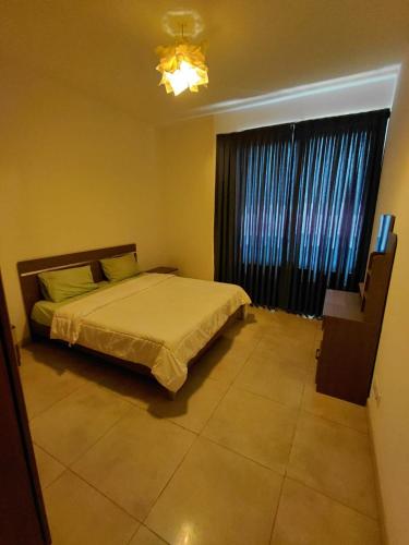 เตียงในห้องที่ Sloane House