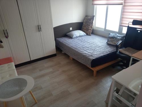 Postel nebo postele na pokoji v ubytování Ocean House - Ipjang