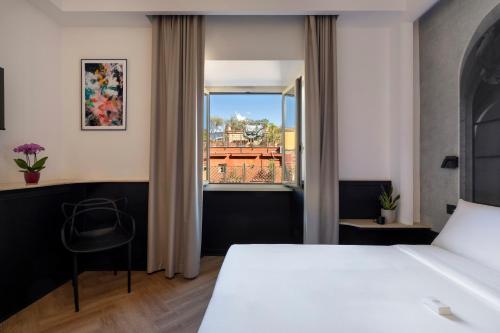 Un pat sau paturi într-o cameră la Boutique Hotel Travé