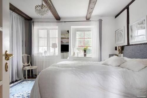 Ένα ή περισσότερα κρεβάτια σε δωμάτιο στο Klockargården Örja byväg 17