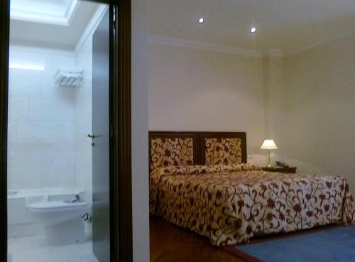 Ένα ή περισσότερα κρεβάτια σε δωμάτιο στο Don Pio