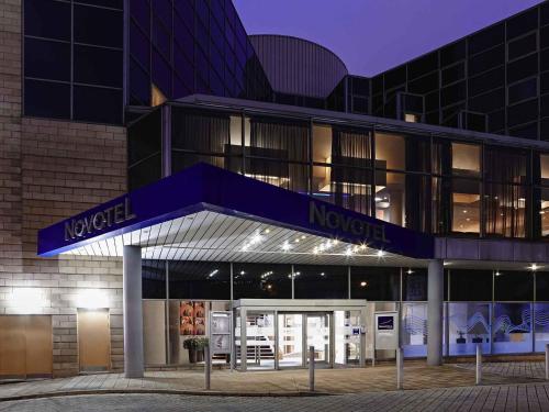 a building with a sign that reads nigel nozsche at Novotel Sheffield Centre in Sheffield