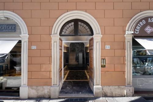 an entrance to a store with two arched windows at Boutique Hotel Travé Rome City Centre in Rome
