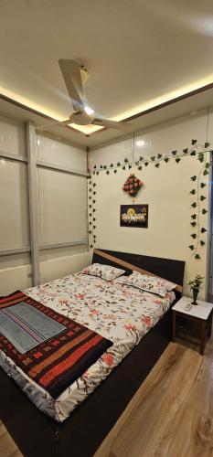 En eller flere senge i et værelse på Welcome Homestay