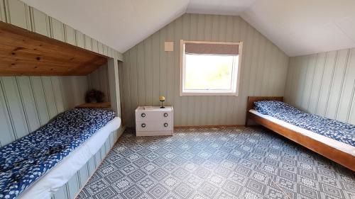 Ένα ή περισσότερα κρεβάτια σε δωμάτιο στο Panorama by the fjord - Stryn