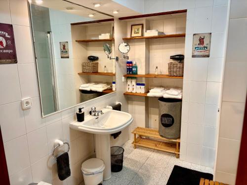 a bathroom with a sink and a mirror at DescubreHome La Casa del Medico in Aznalcázar