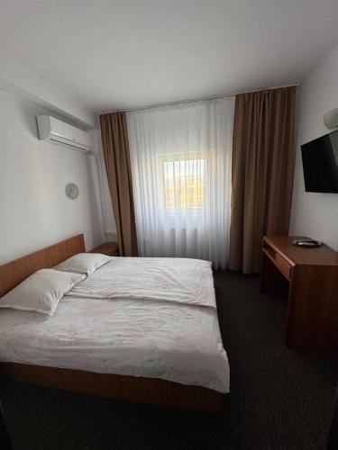 Кровать или кровати в номере Casa de Piatra Bistro