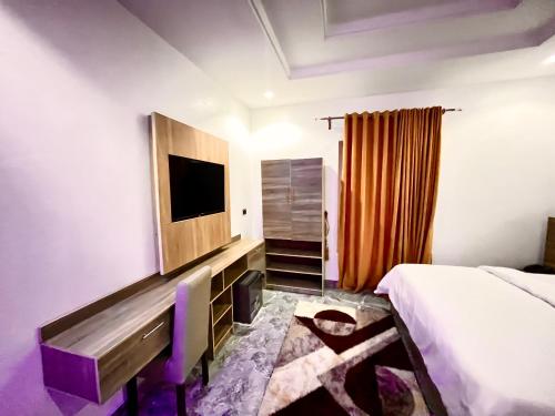 Μια τηλεόραση ή/και κέντρο ψυχαγωγίας στο De New Dawn Hotel And Lounge