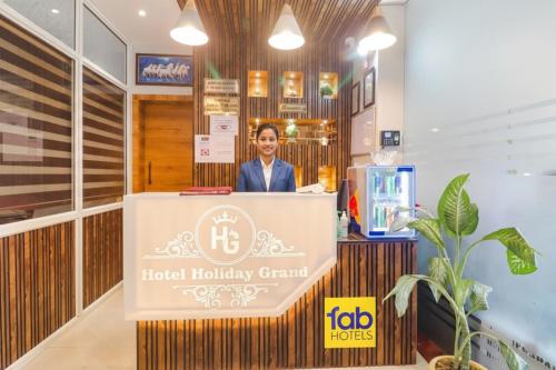 Un certificado, premio, letrero u otro documento en FabHotel Holiday Grand