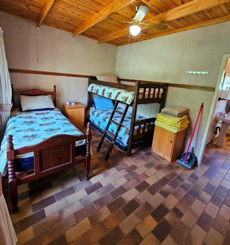 a bedroom with two bunk beds and a wooden ceiling at Home with The Hoffs in Smithfield