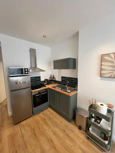 Kuchyň nebo kuchyňský kout v ubytování La Location des Géants - Appartement avec terrasse