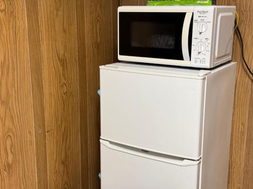 Kuchyň nebo kuchyňský kout v ubytování 木の家ゲストハウス小山西口館