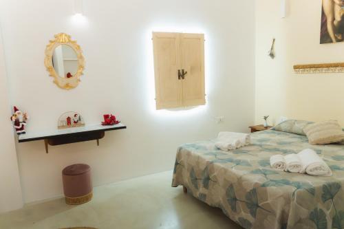 Giường trong phòng chung tại Corte Mercurio B&B