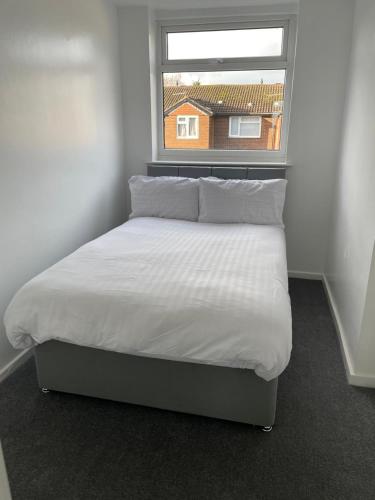 Ένα ή περισσότερα κρεβάτια σε δωμάτιο στο Modern 3 Bed