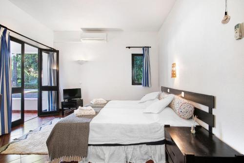 Ένα ή περισσότερα κρεβάτια σε δωμάτιο στο Cozy Studio Pedras Del Rei