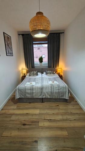 Ένα ή περισσότερα κρεβάτια σε δωμάτιο στο Lux Apartment parking gratis