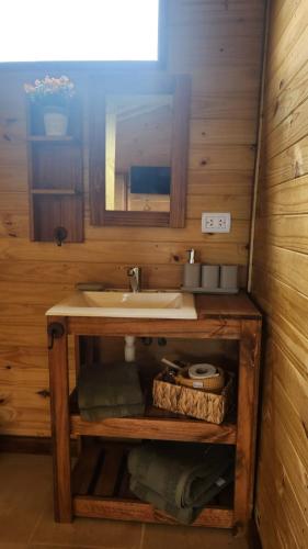 a bathroom with a sink and a mirror at Cabañas Potrero de Marquez Paraiso Adult only in Potrero de Garay