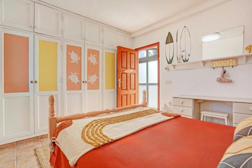 En eller flere senge i et værelse på Casa Dolly