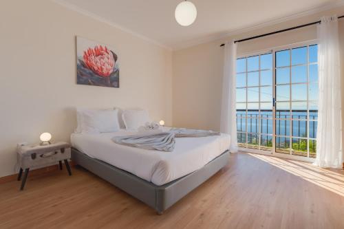 Ένα ή περισσότερα κρεβάτια σε δωμάτιο στο Casa da Laranja by Holiday Rental Madeira