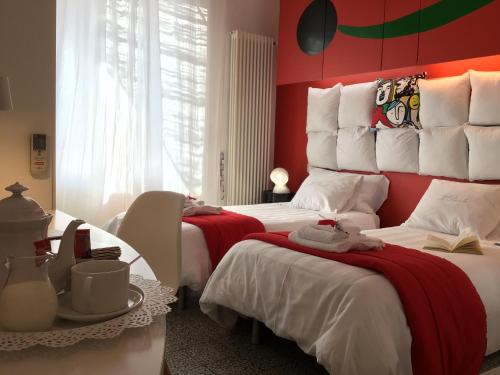 Postel nebo postele na pokoji v ubytování Il Piccolo Rooms