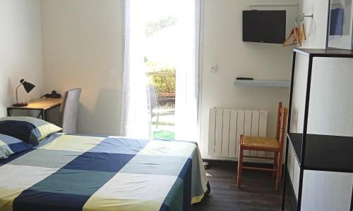 Ένα ή περισσότερα κρεβάτια σε δωμάτιο στο BonAbri Vacances - Chambres d'hôtes