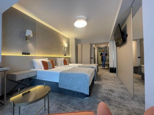 Postel nebo postele na pokoji v ubytování Hotel Univers