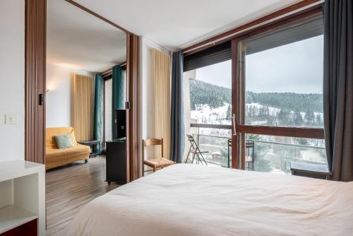 En eller flere senge i et værelse på Escapade nature Ski rando farniente