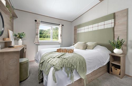 Ένα ή περισσότερα κρεβάτια σε δωμάτιο στο Heather View Essential Clover Caravan 2